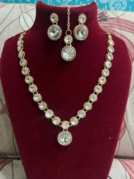 gold plated crystal round stone necklace set with earrings and maang tikka
