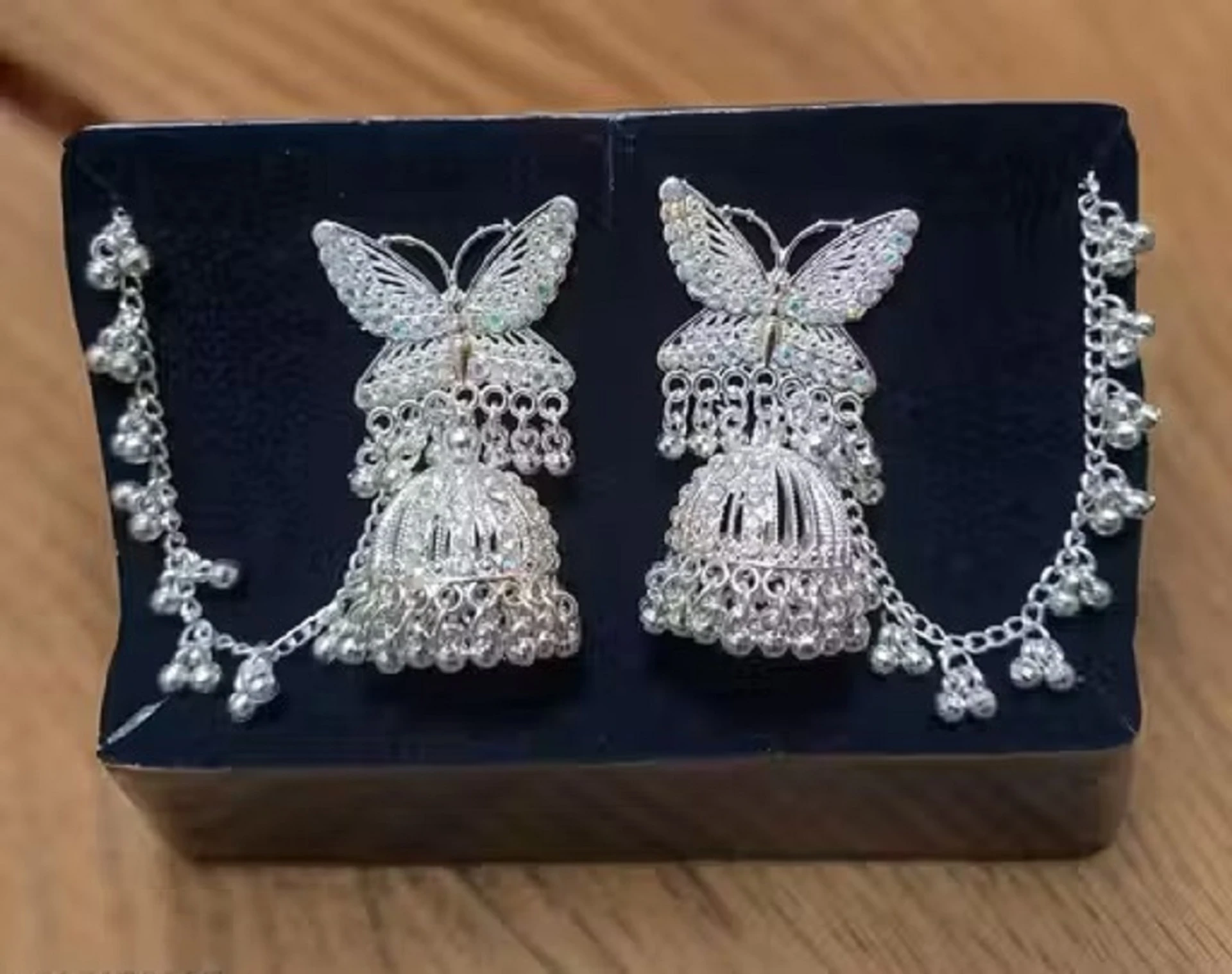 butterfly oxidised silver jhumka earrings with ghungroo chain design butterfly oxidised silver jhumka earrings with ghungroo chain design
